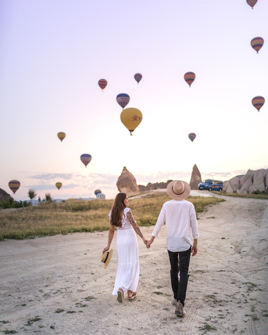 couple watching hot air balloons
