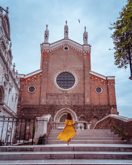 girl goes over the bridge to Basilica dei Santi Giovanni e Paolo