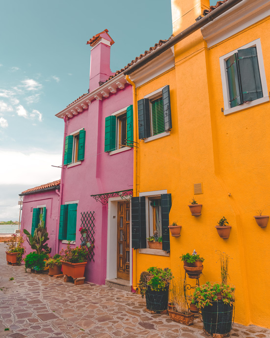 See the Mad colored houses of Burano island