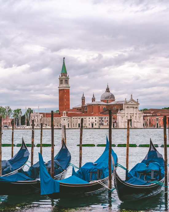 parking lot of gondolas on the background of Basilica di San Giorgio Maggiore