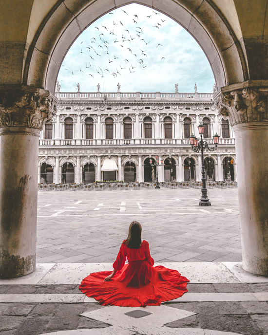 Anna sitting on the Piazza San Marco