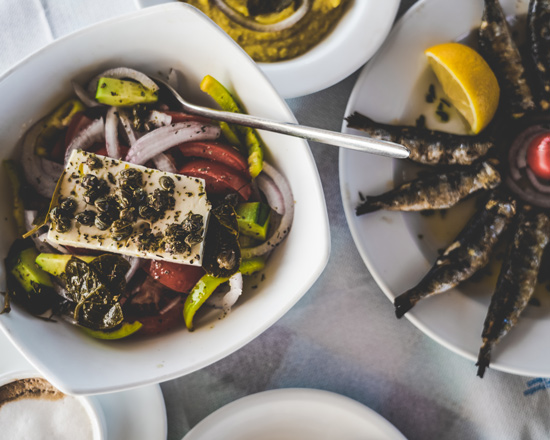 greek salad and grilled sardines