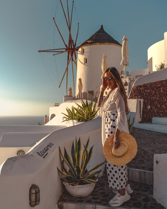 Beautiful view of picturesque windmills of Santorini